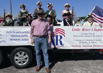 Skunk Brigade rides in Annual Livestock Parade