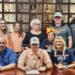 Gray signs  to play golf at Brewton-Parker College