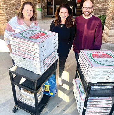 SPS PTO surprises staff with pizza