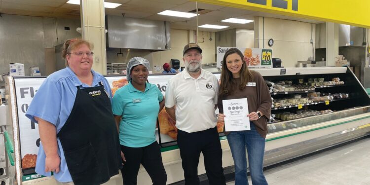 Harvey’s and Men’s Golf Association make donations