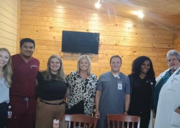 EMC staff members speak to Exchange