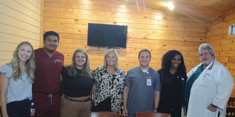 EMC staff members speak to Exchange