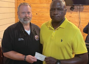 Exchange Club donates to book bag drive