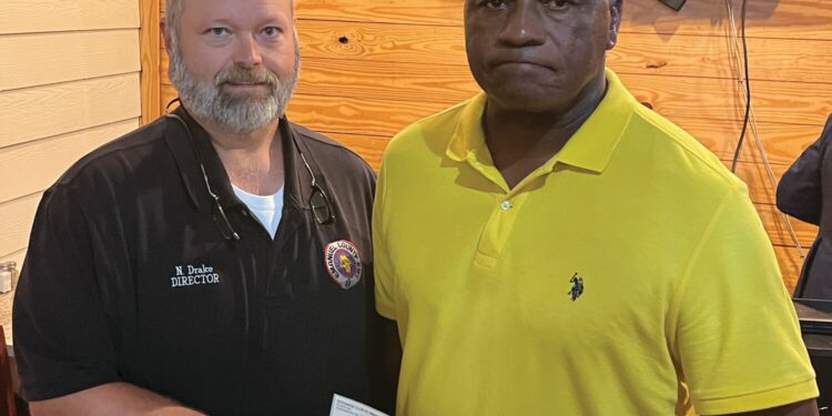 Exchange Club donates to book bag drive