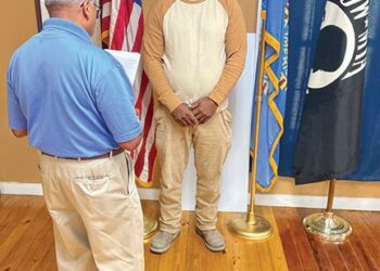 Commander Bush swears Lockett in