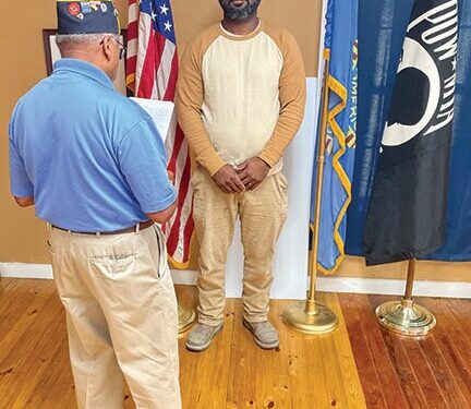 Commander Bush swears Lockett in