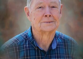 John D. Scott, 84