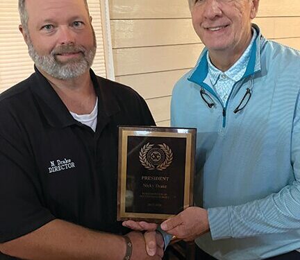 Drake presented President’s Award at Exchange meeting