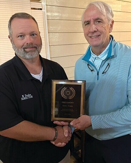 Drake presented President’s Award at Exchange meeting