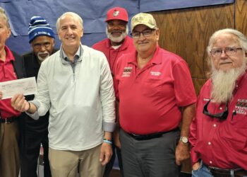 Mason presents check to Veterans at the Library